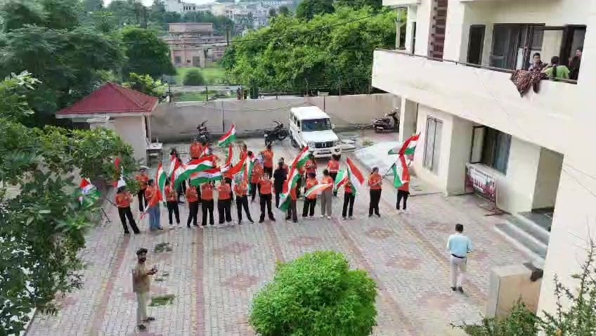 Recruits line the route with the tricolour